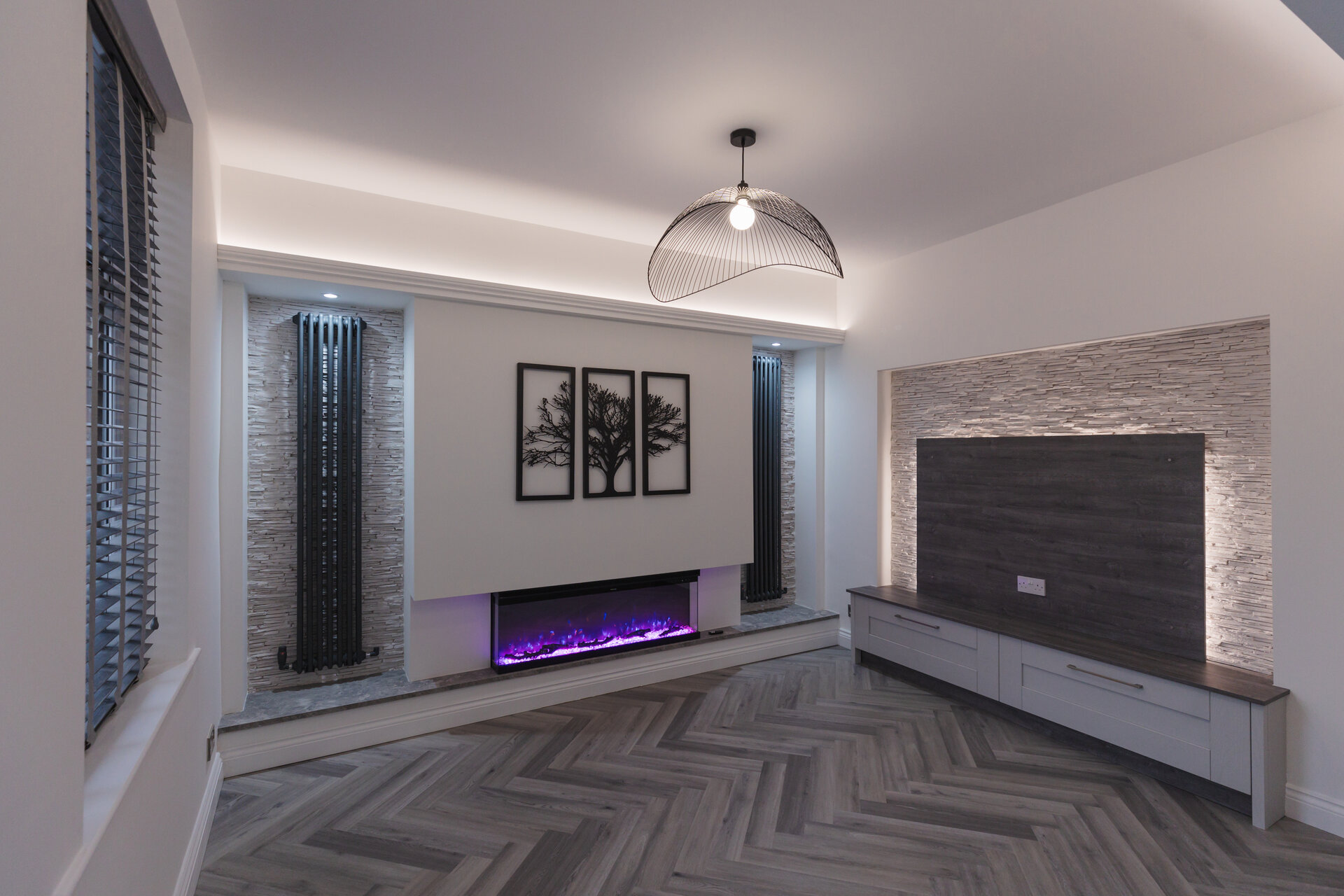 Electric stove and fire displays alongside tile samples in the Home Design Products showroom